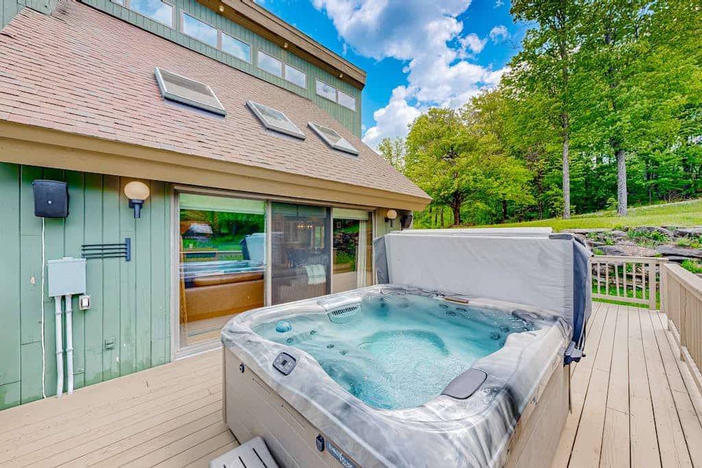 3-story secluded home with private sauna, hot tub, pond on-site