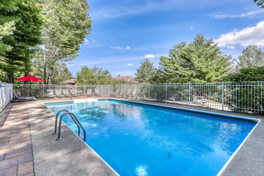 Picturesque mountain view condo with fireplace, balcony, deck, pool, & kitchen