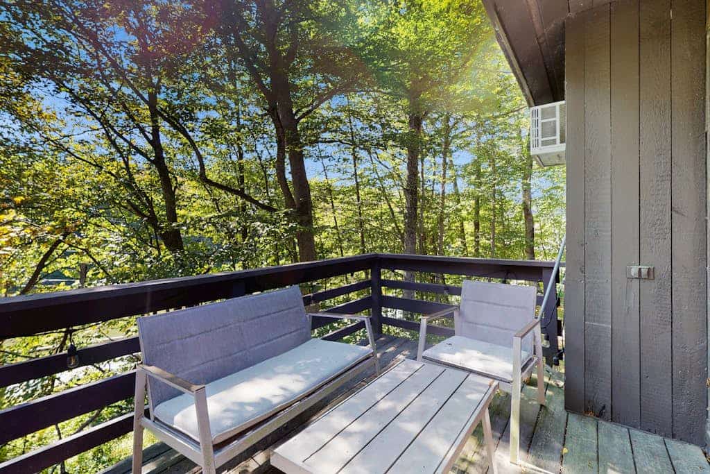 Cozy condo w/ balcony, river view, electric woodstove, w/d, wifi, kitchen, a/c