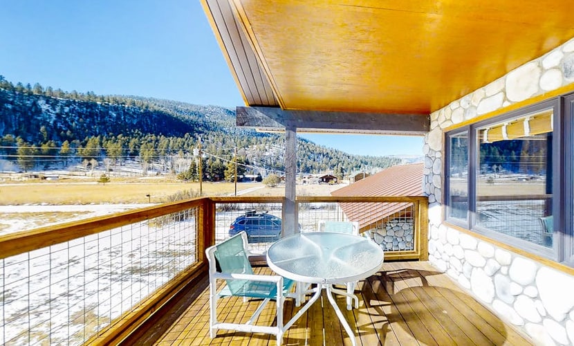 River view retreat with mountain views - hot tub, balcony, wood stove & W/D