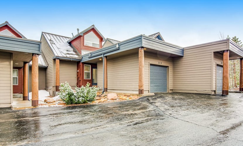 Home with hot tub, gas fireplace, and garage