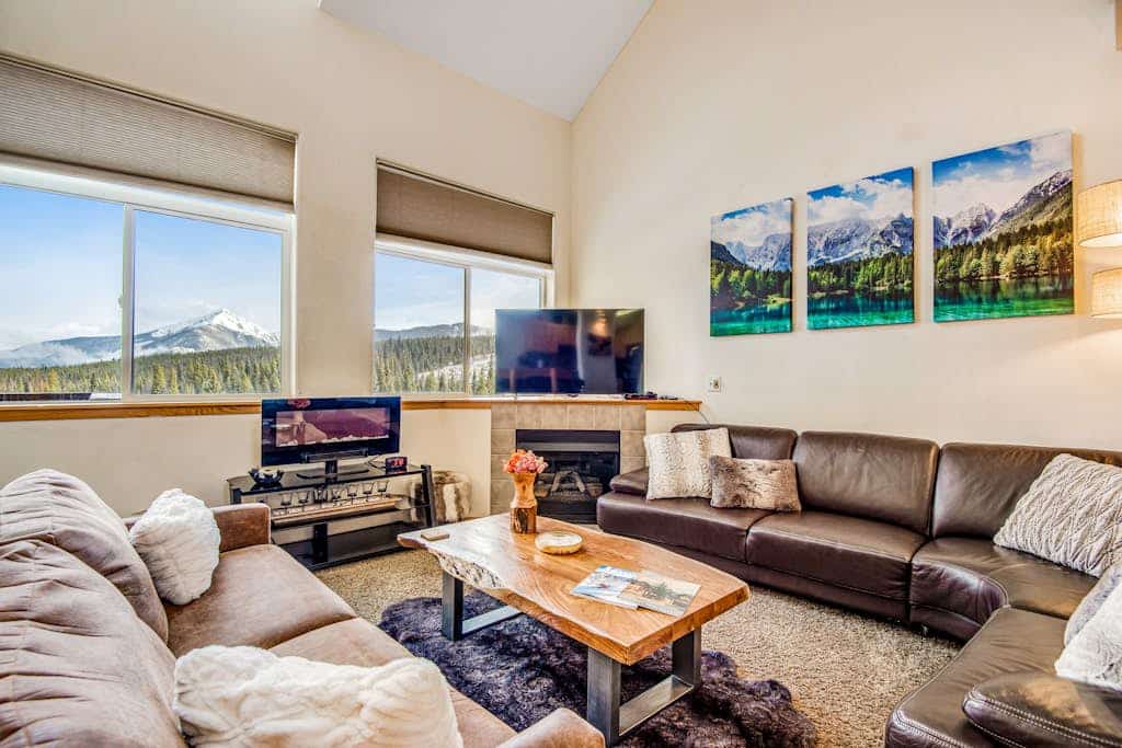 Home with hot tub, gas fireplace, and garage