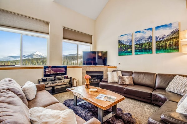 Home with hot tub, gas fireplace, and garage