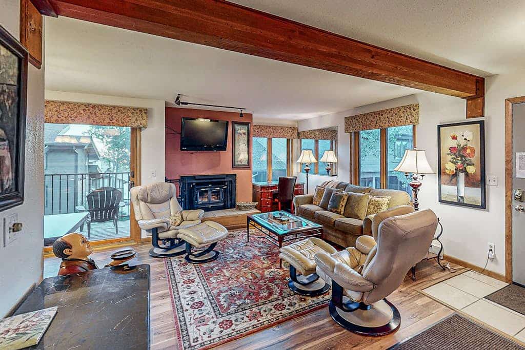 Snowbird-friendly with year-round hot tub, balcony & wood fireplace