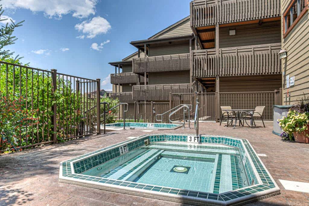 Upscale condo with balcony, pool, hot tubs, & fireplace - walk to lifts