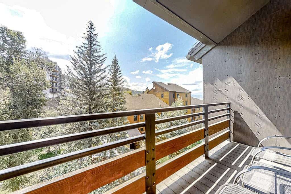 Three-level, forest-view condo w/ a loft, furnished balcony, & shared hot tubs
