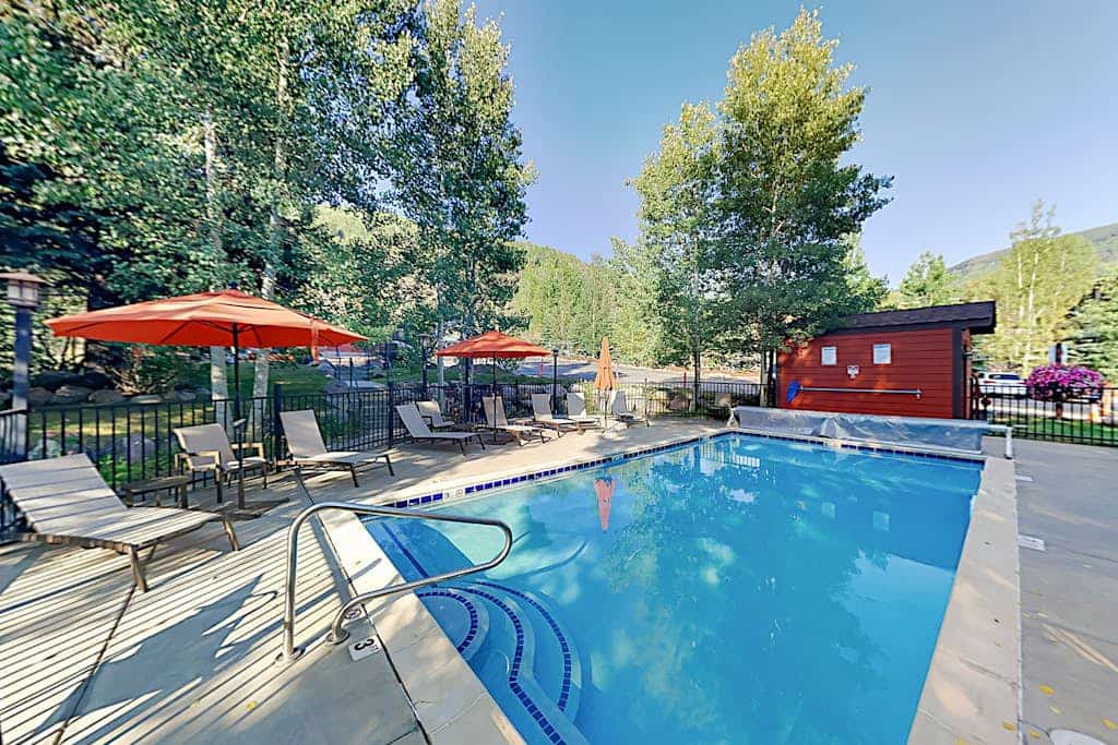 Ski slope-view condo on Gore Creek with fireplace - walk to Vail Village
