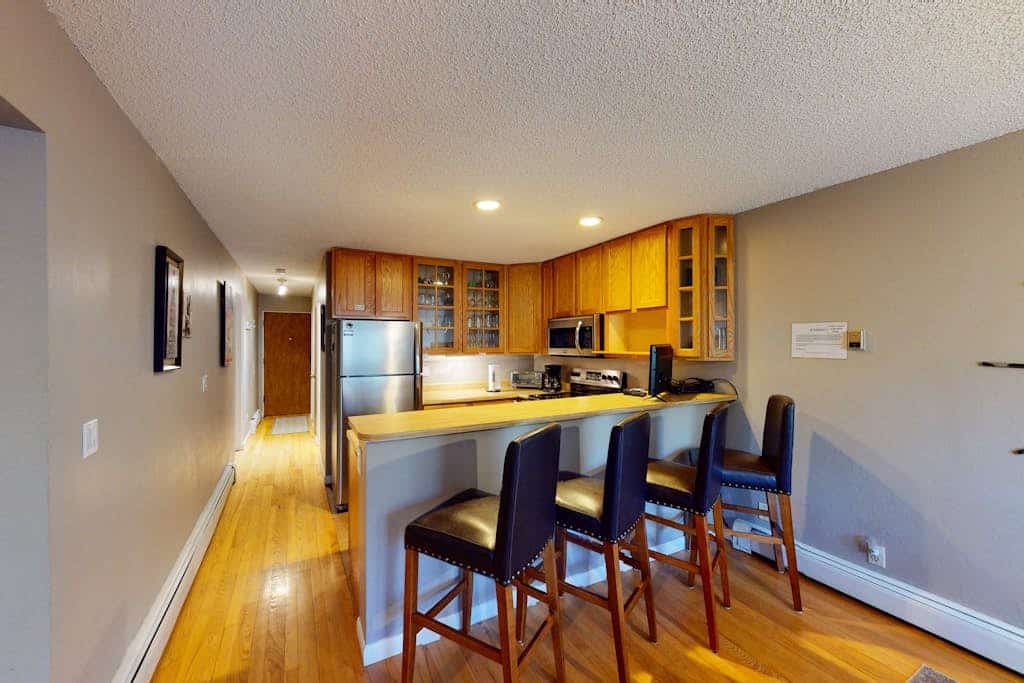 Ski slope-view condo on Gore Creek with fireplace - walk to Vail Village