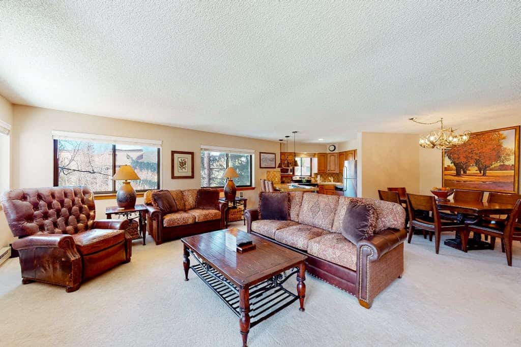 Upgraded ski condo with fireplace, hot tubs, & gym
