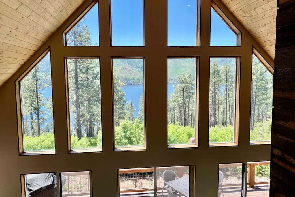 Amazing lake view home with fireplace, W/D, kitchen, grill, balcony, and deck