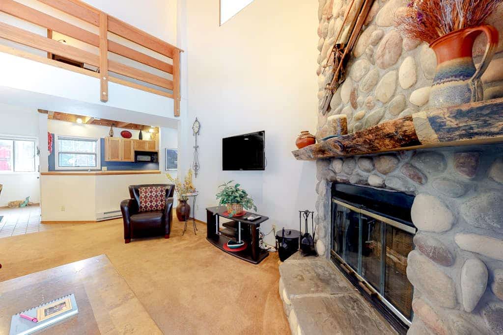 Two-story condo with a hot tub, WiFi, & wood-burning fireplace