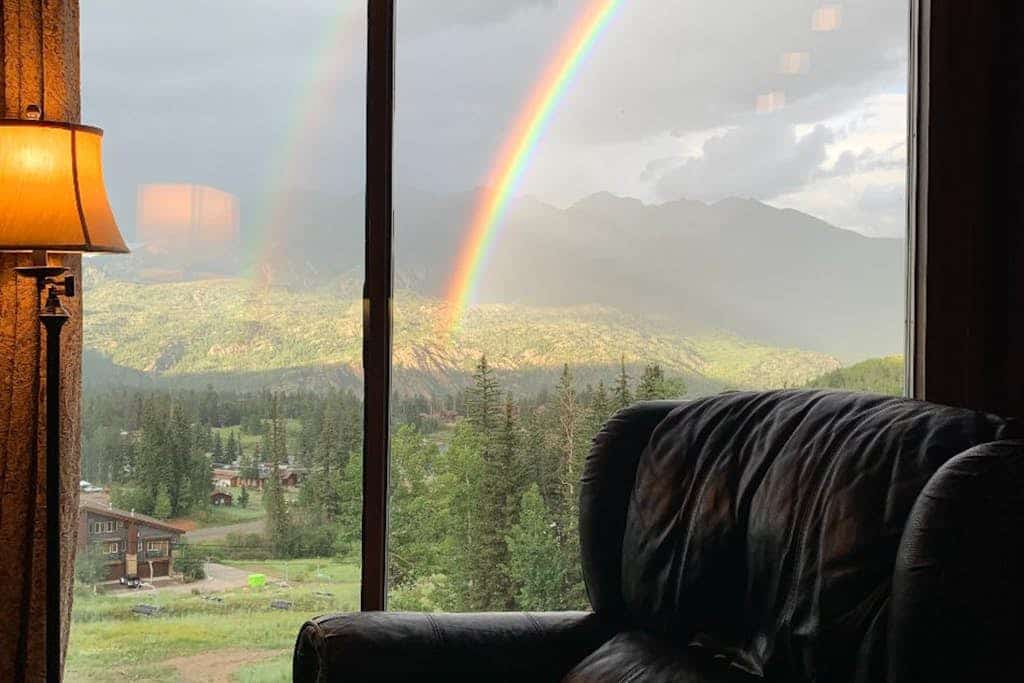 Ski-in/ski-out condo with lake and mountain views, woodstove