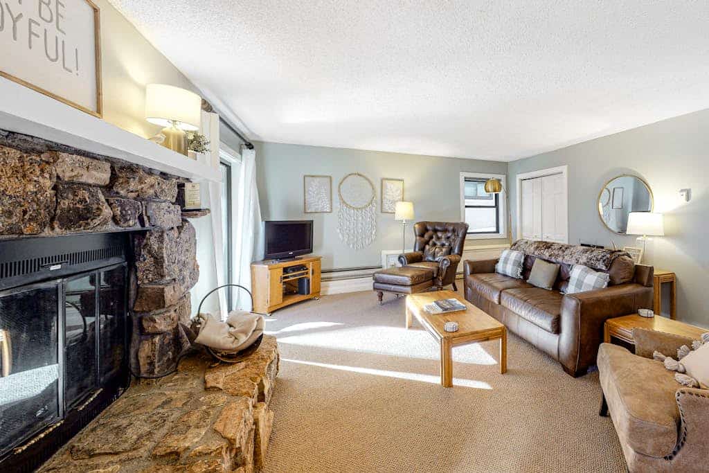 Mountain-view condo with private deck, fireplace & hot tub