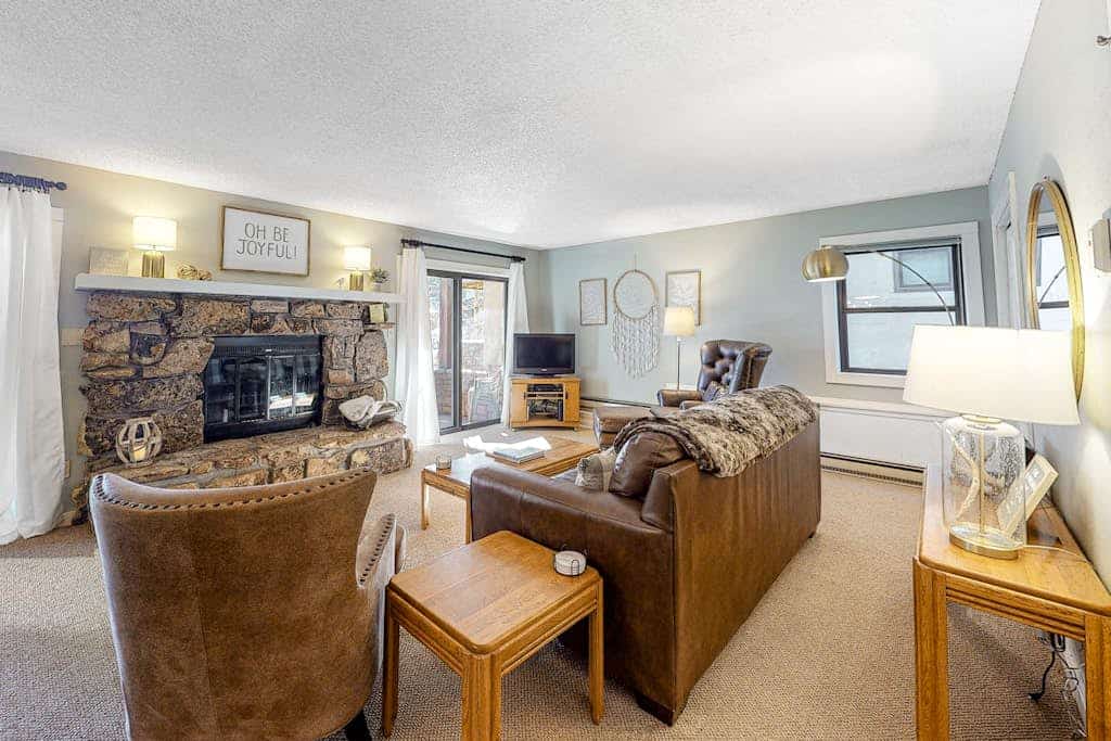 Mountain-view condo with private deck, fireplace & hot tub