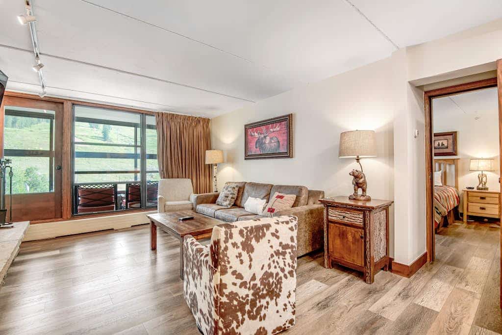 Village condo w/ sun room, fireplace & shared hot tub/grill - steps to lifts