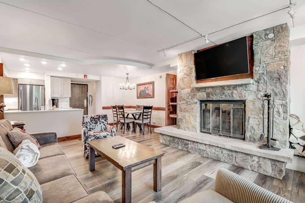 Village condo w/ sun room, fireplace & shared hot tub/grill - steps to lifts