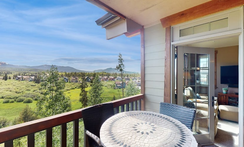 Mountain-view condo on ski shuttle route with deck & fireplace