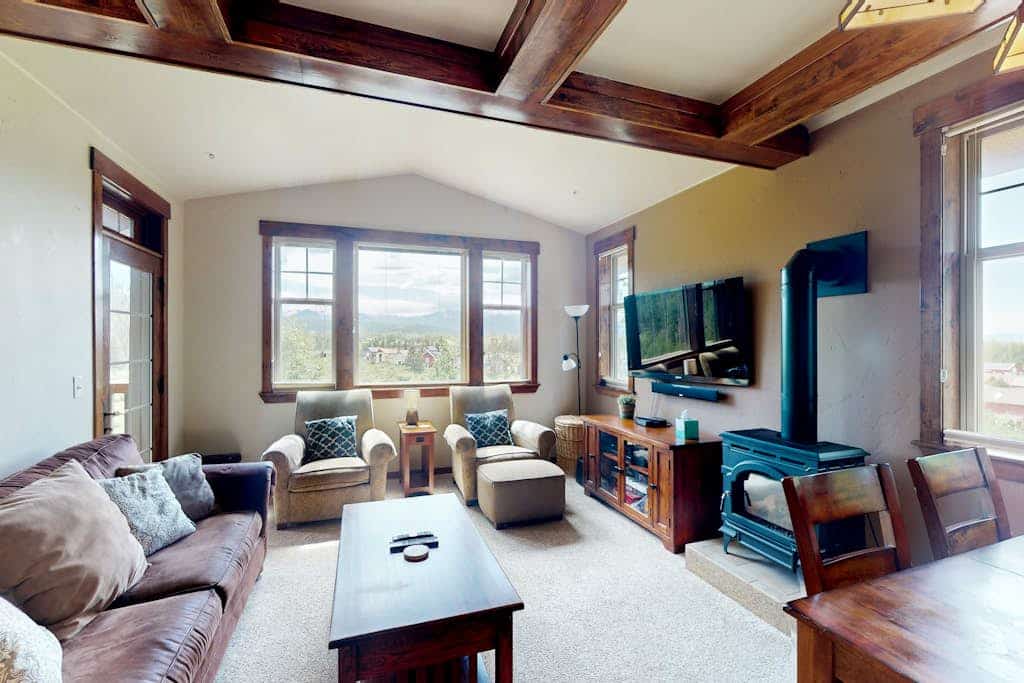 Mountain-view condo on ski shuttle route with deck & fireplace