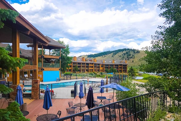 2-story condo with loft, balcony, indoor & outdoor pools, game room, gym, W/D