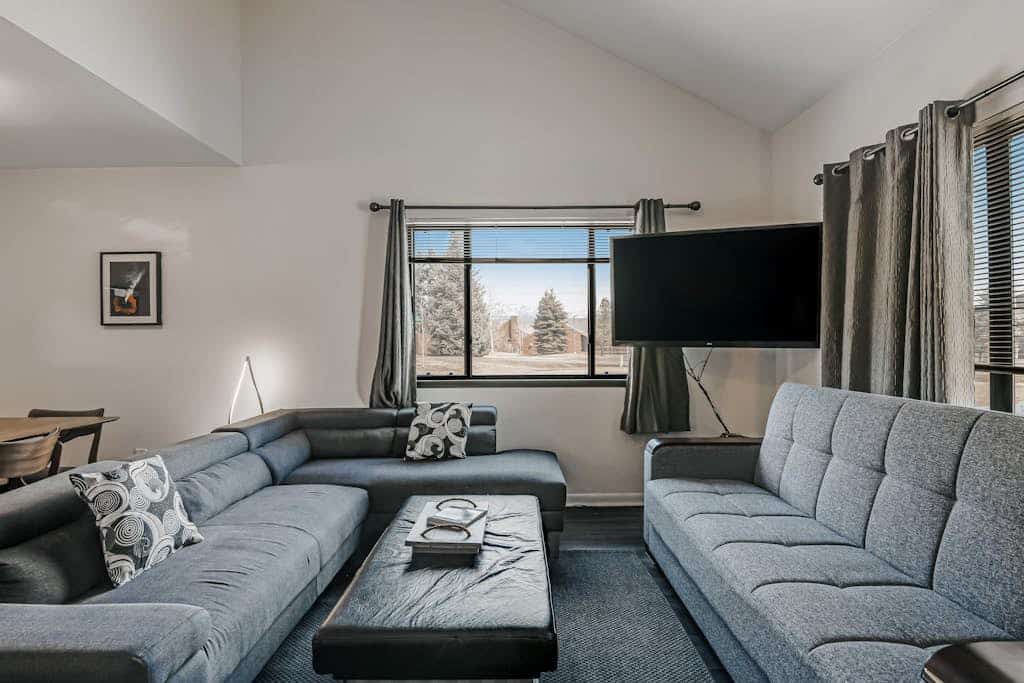 Two-Level Condo w/ Mountain View, Wood Stove, WiFi, Laundry & Central Location