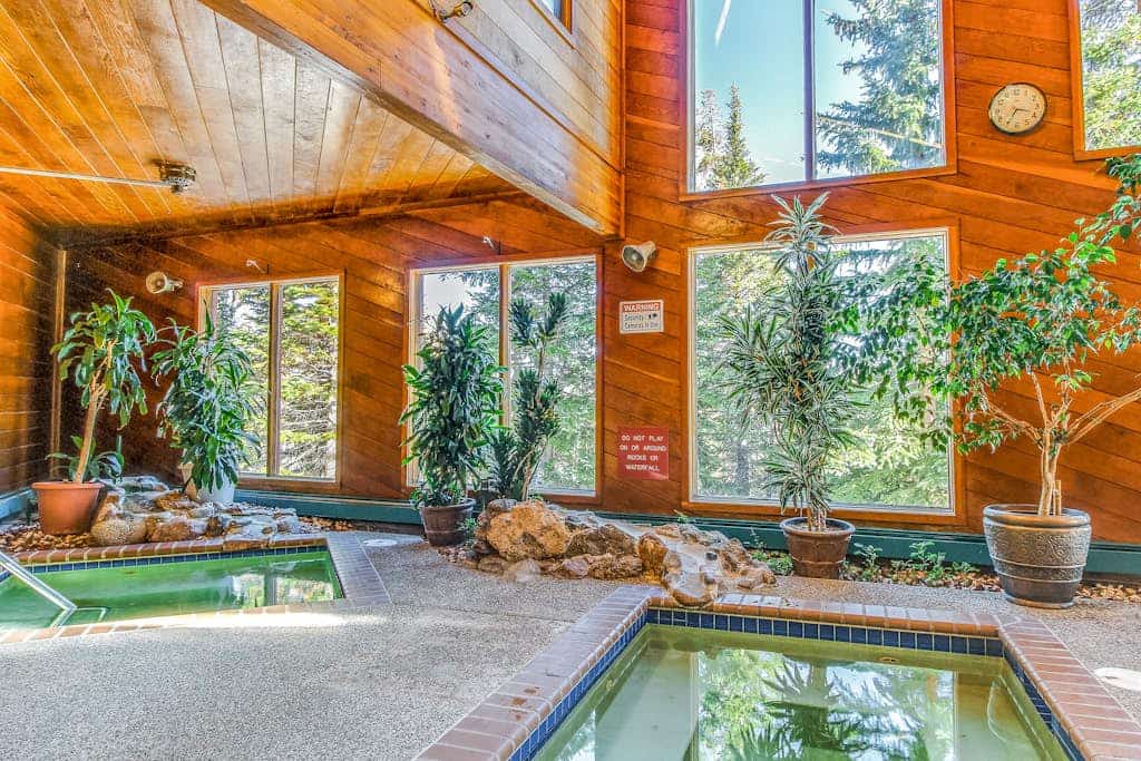 Mountain view ski condo with gas fireplace, pool, & hot tub - washer/dryer access