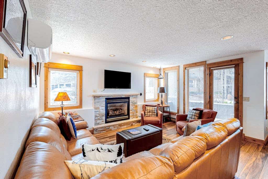 Serene ski condo with a private dry sauna, gas fireplace, AC, & pool access