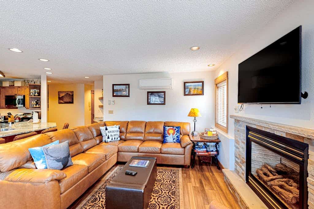 Serene ski condo with a private dry sauna, gas fireplace, AC, & pool access