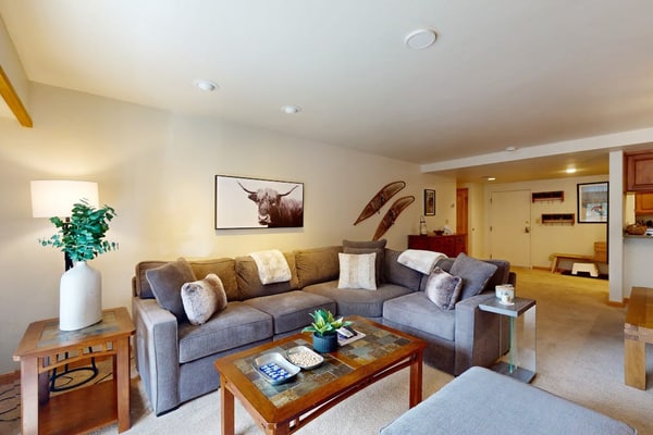 Mountain view condo with large balcony, pool & hot tub - steps to ski shuttle