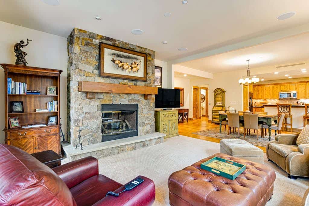 Second-floor retreat near the slopes with grill, fireplace, pool, & hot tub