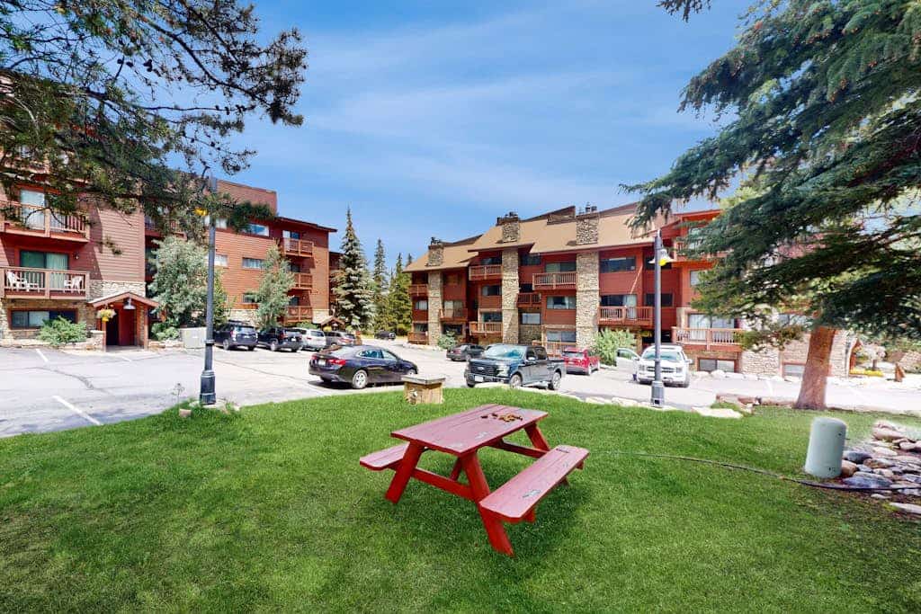 Spacious ski condo with fireplace, hot tubs, gym, & mountain views
