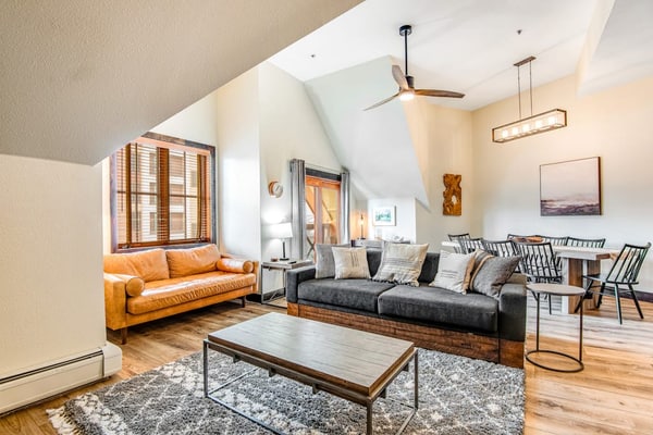 Fifth-floor condo with river views, hot tubs, pool & gym - walk to Peak 9 lifts