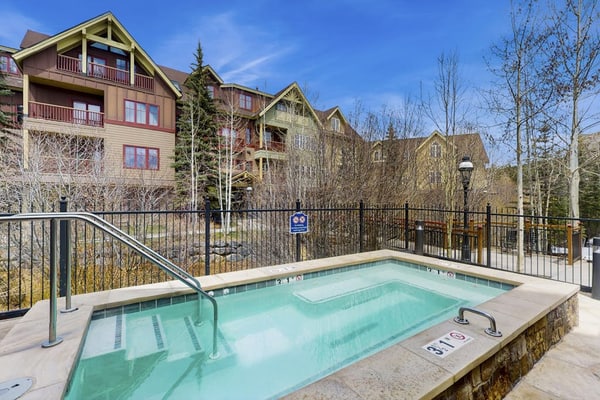 Luxury ski condo steps from QuickSilver Lift with pool, hot tubs & gym
