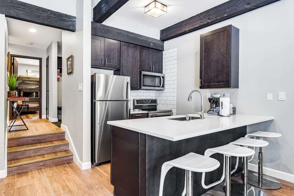 Mountain condo with fireplace, patio, pool, & hot tubs - walk to lifts/Main St