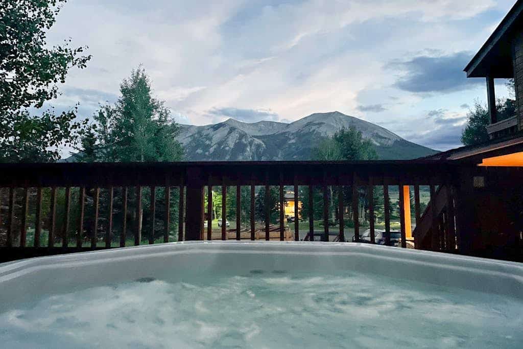 Mountain-view condo with hot tub - drive minutes to slopes & trails