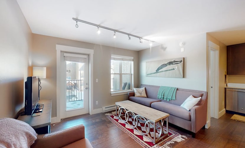 Comfortable condo with sweeping mountain views, private balcony, & washer/dryer