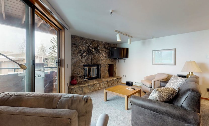 Lakefront Condo with Mountain Views & Shared Hot Tub - Walk to Town & Ski Access