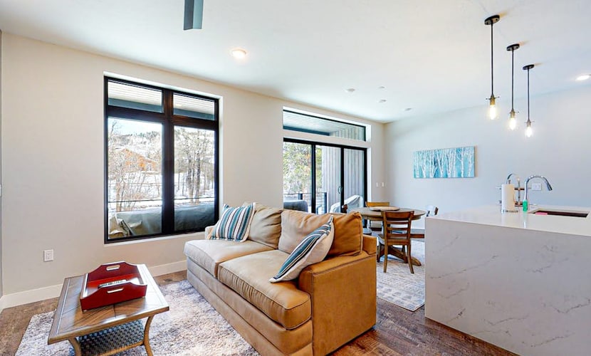 Modern riverfront condo w/ a gas fireplace, washer/dryer & private patio