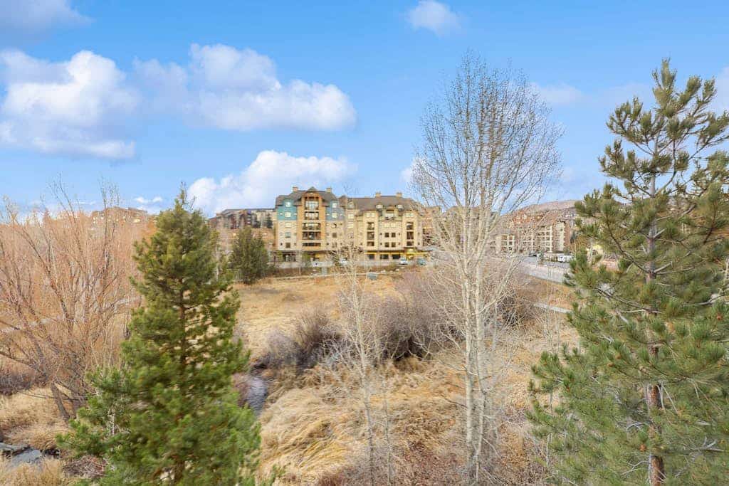 Top-floor condo overlooking Burgess Creek w/ a shared pool, hot tub, & gym