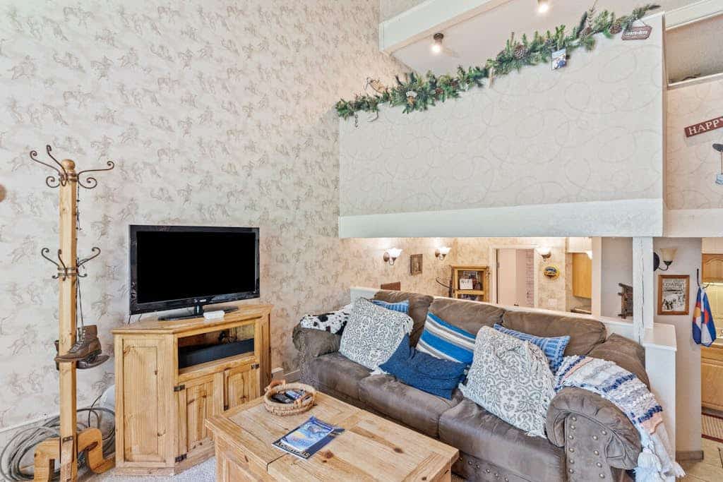 Ski-in/ski-out mountain view condo with gas fireplace, hot tubs, & fitness room