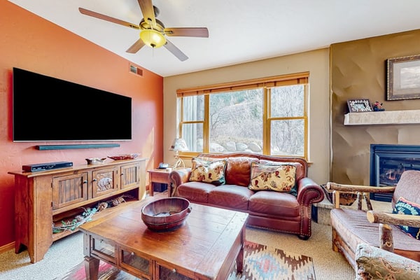 Mountainside condo with ski, hot tub access - grill, walk-out patio, & fireplace