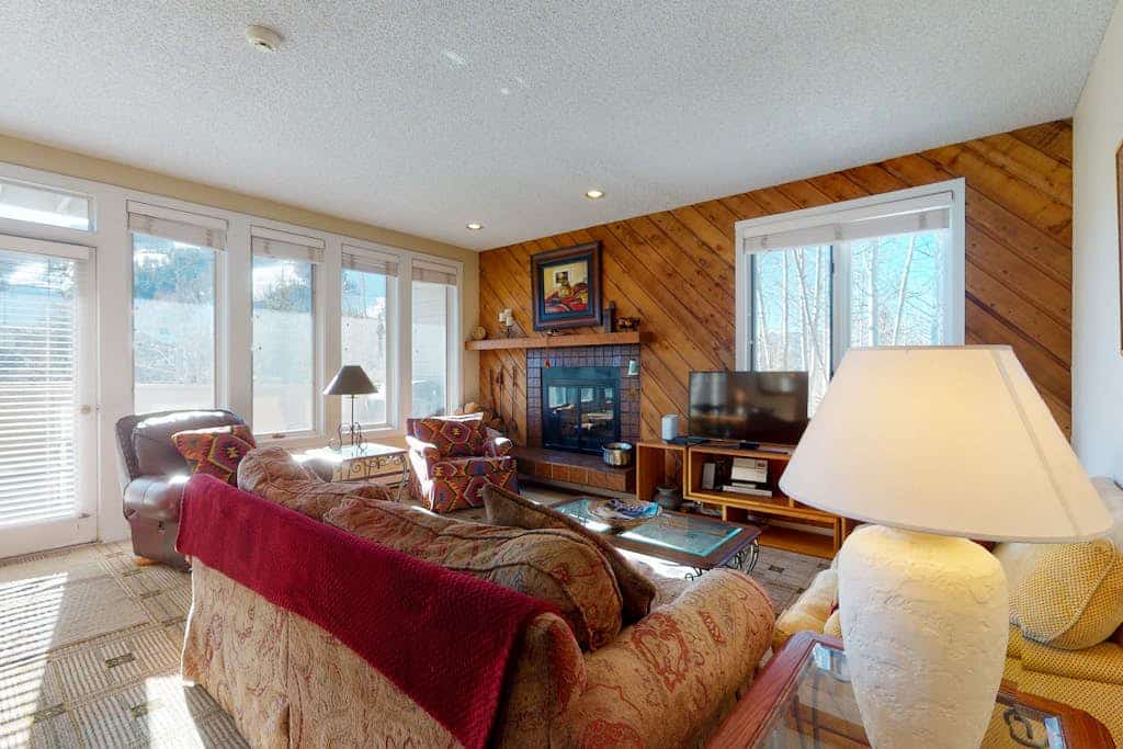 Western-inspired condo w/ wood fireplace, full kitchen, & shared hot tub & pool
