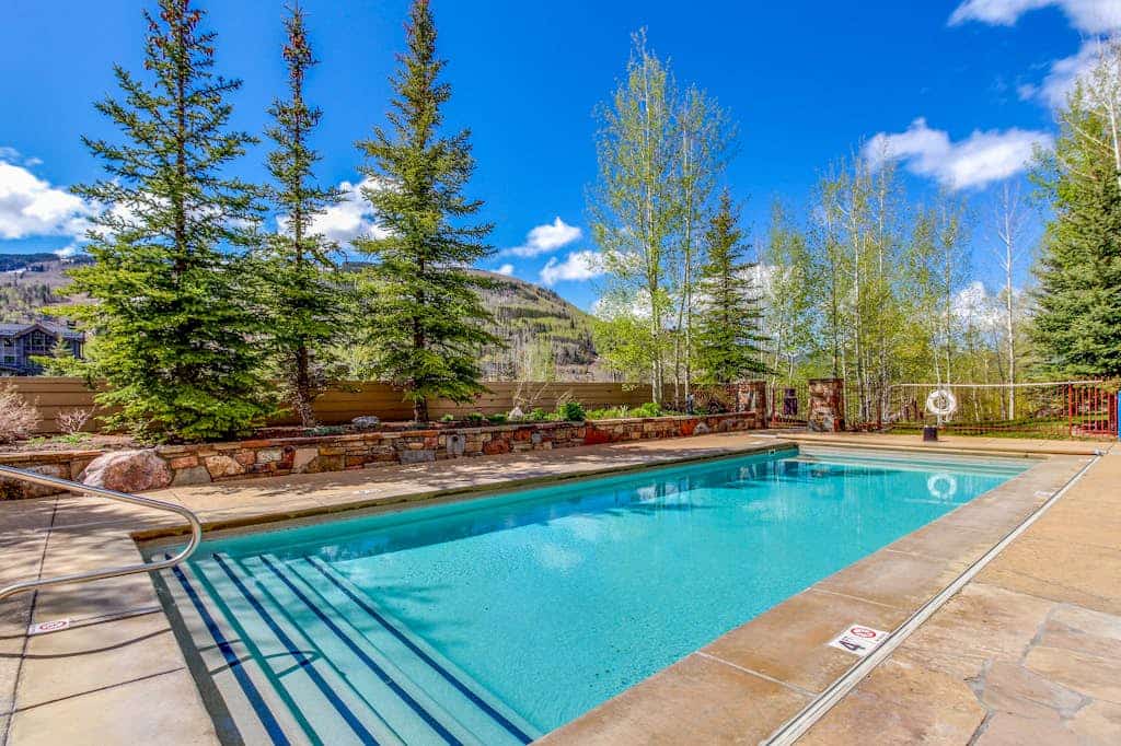 Western-inspired condo w/ wood fireplace, full kitchen, & shared hot tub & pool