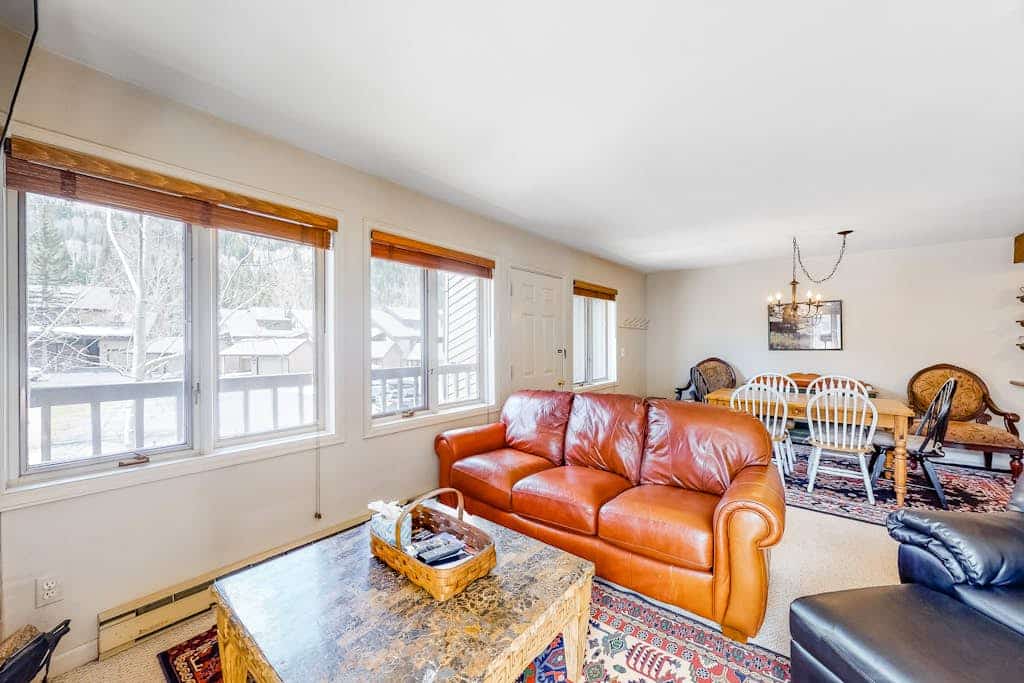 Walk to the Ski Shuttle Bright Condo w/ Fireplace & Shared Hot Tub/Pool