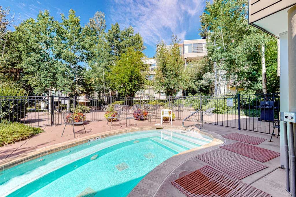 Charming condo with resort amenities, sweeping views, & wood-burning fireplace