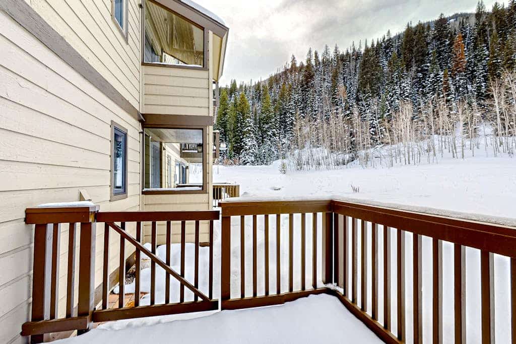 Mountain-view condo with fireplace, W/D, & shared amenity access