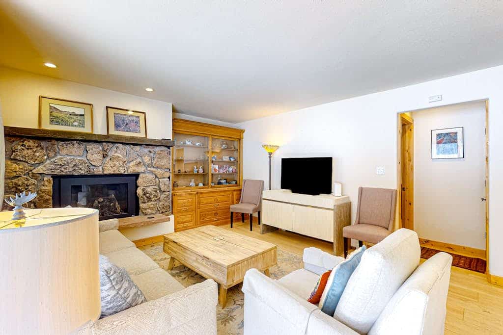 Mountain-view condo with fireplace, W/D, & shared amenity access