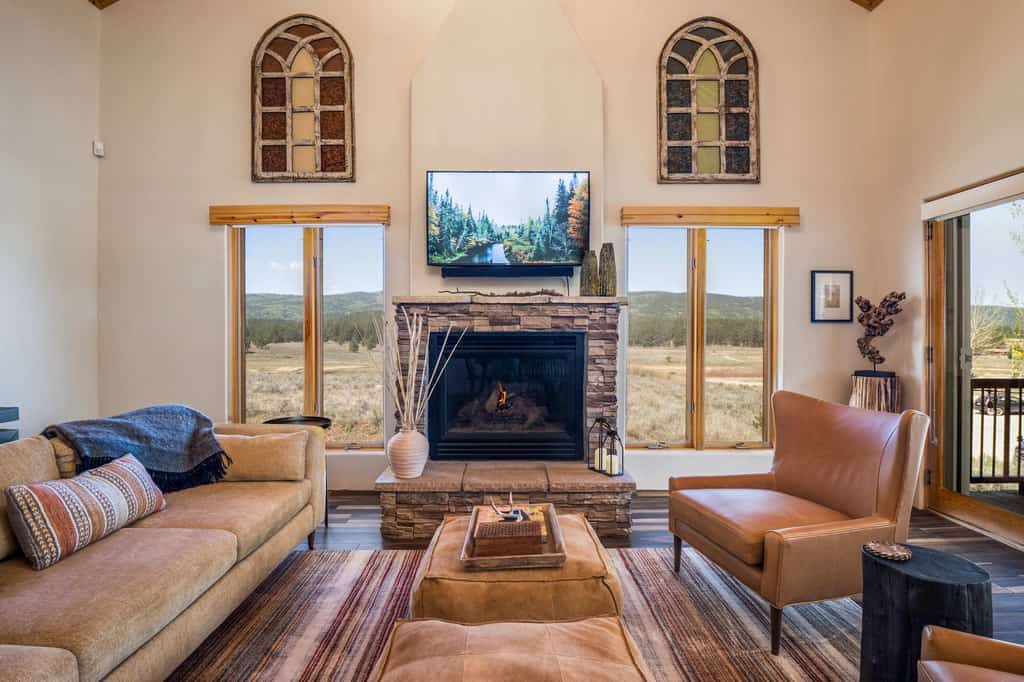 Welcome to Alpine Glow Chalet, a beautifully updated 3-bedroom Angel Fire mountain condo made for comfort, connection, and year-round adventure. Less than a mile from Angel Fire Resort, enjoy easy access to skiing, biking, hiking, and mountain activities, then come home to peaceful views, a warm elevated interior, cozy fireplace, large private patio, and firepit. Start mornings with coffee outside, share dinner around the table, and unwind by the fire after exploring.