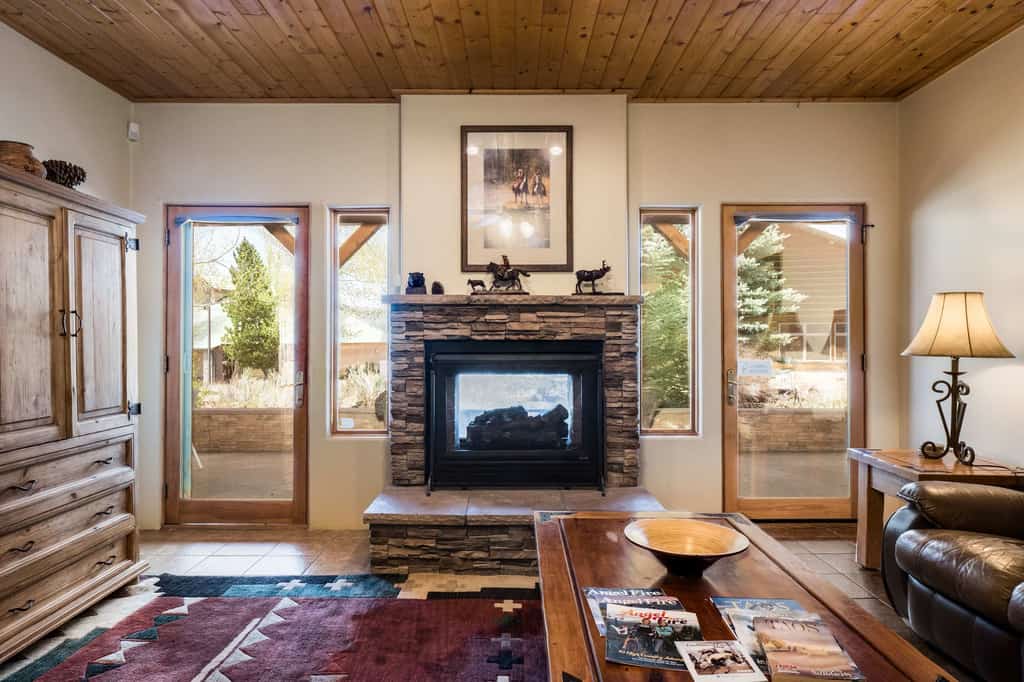 Welcome to Fireside Base Camp, a warm 3-bedroom Angel Fire condo designed for comfort, connection, and year-round mountain adventure. Close to Angel Fire Resort, enjoy easy access to skiing, biking, hiking, and mountain activities, then come home to a cozy open living space, full kitchen, and covered patio with an indoor/outdoor fireplace. Sip coffee outside, share dinner after exploring, and unwind by the fire as the mountain air settles in around you.