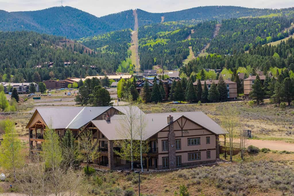 Welcome to Fireside Base Camp, a warm 3-bedroom Angel Fire condo designed for comfort, connection, and year-round mountain adventure. Close to Angel Fire Resort, enjoy easy access to skiing, biking, hiking, and mountain activities, then come home to a cozy open living space, full kitchen, and covered patio with an indoor/outdoor fireplace. Sip coffee outside, share dinner after exploring, and unwind by the fire as the mountain air settles in around you.