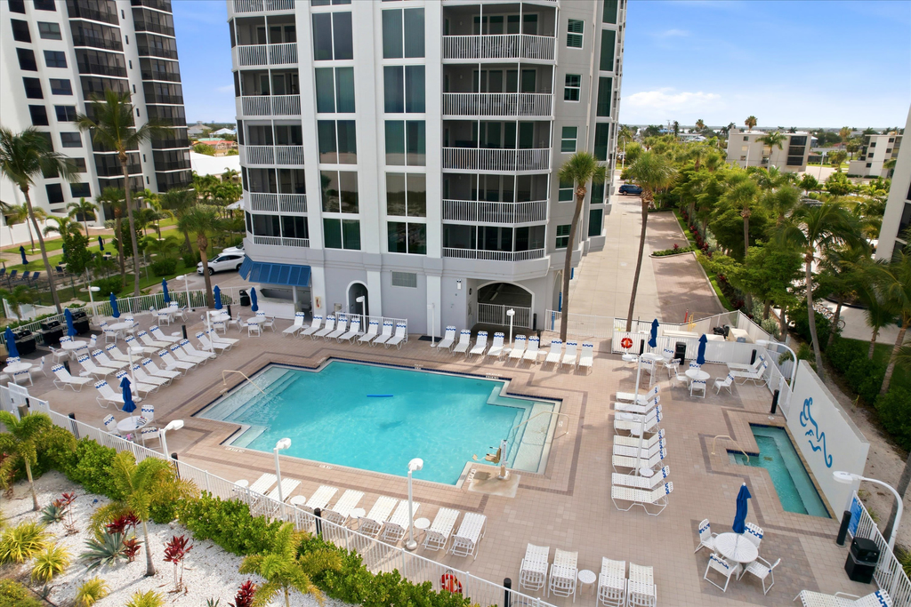 Beachfront Bliss, Cozy Condo with Patio, Pool & Stunning Views!